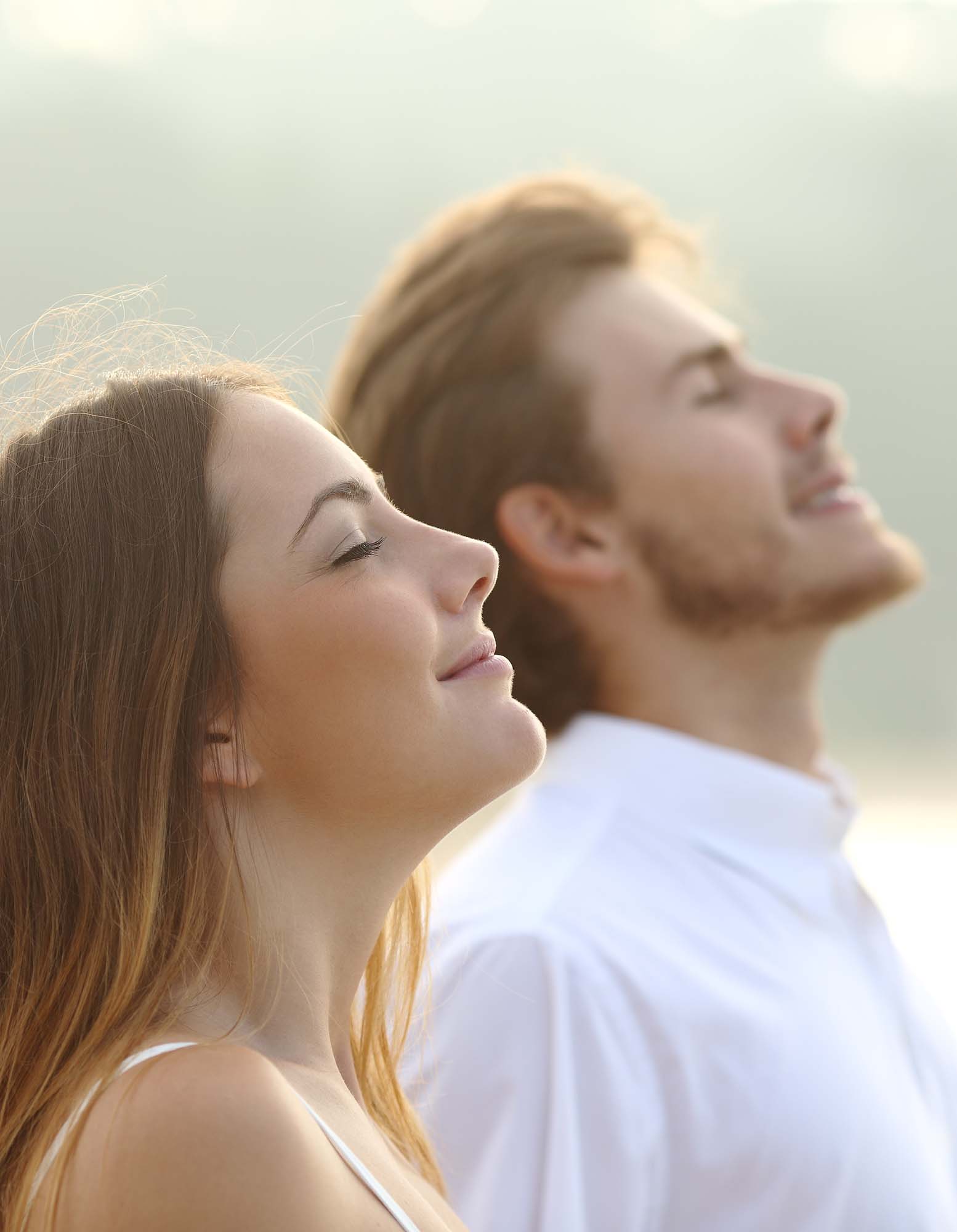 Couple of man and woman breathing deep fresh air
