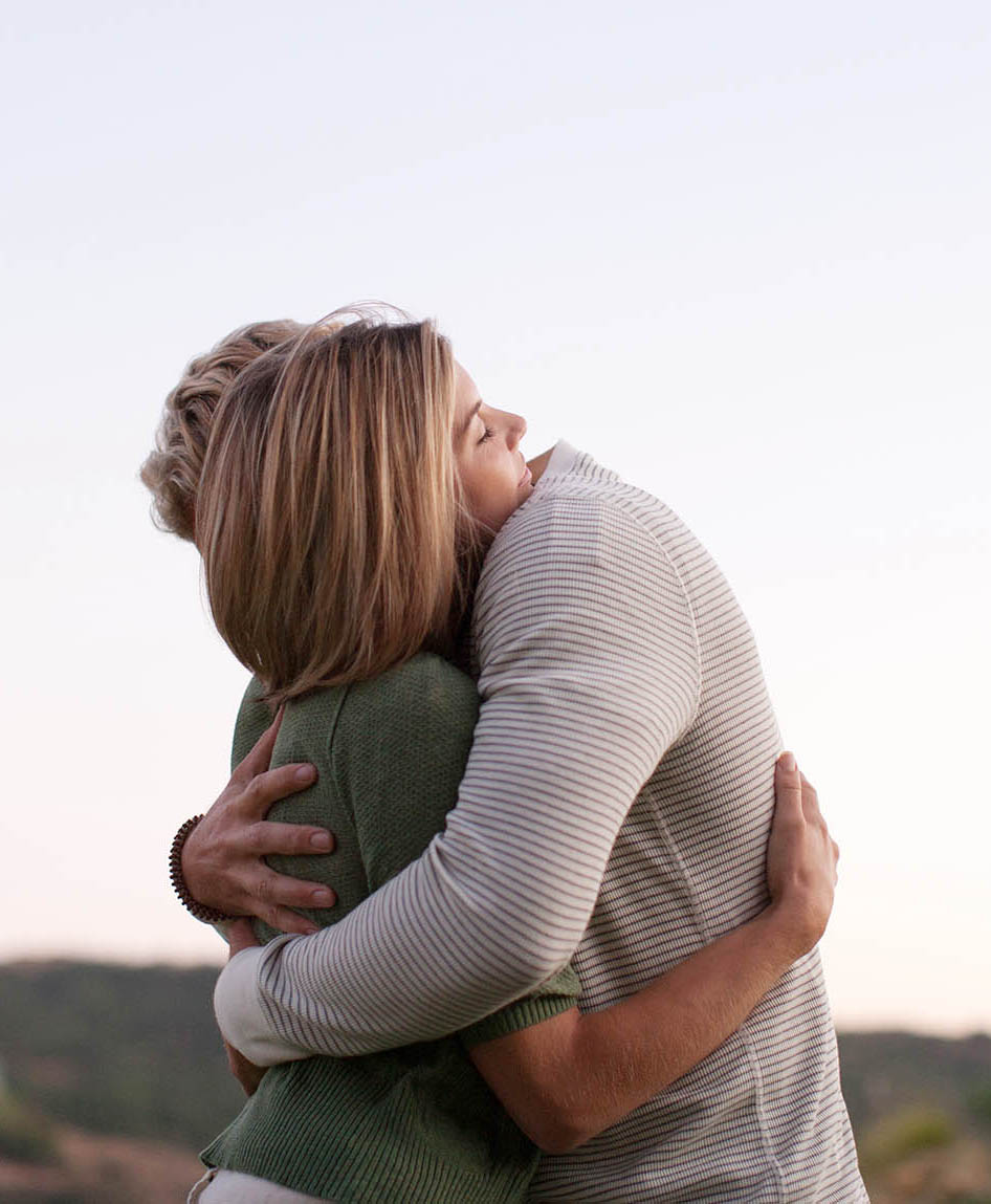 Couple hugging outdoors