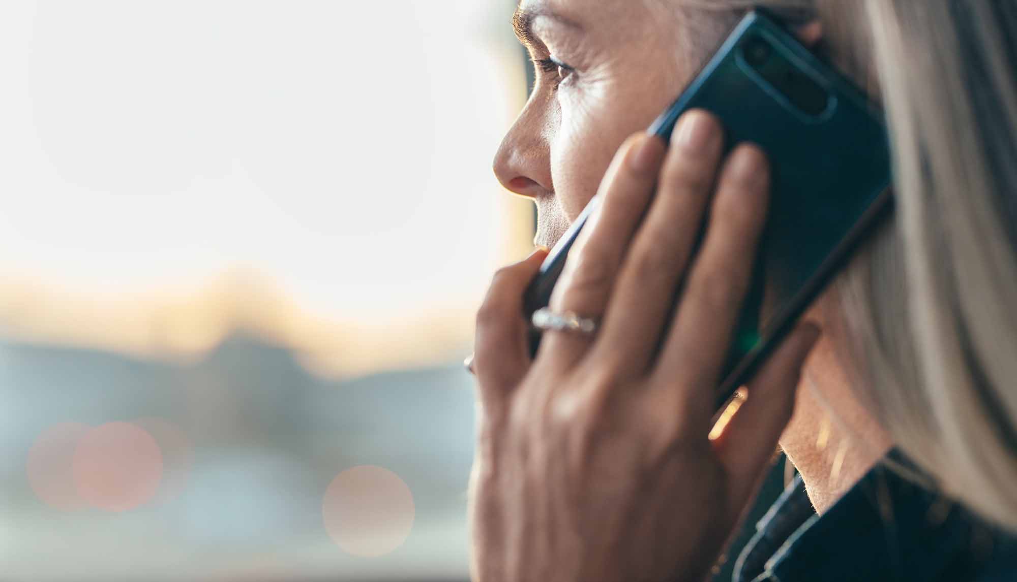 Senior business woman making a phone call